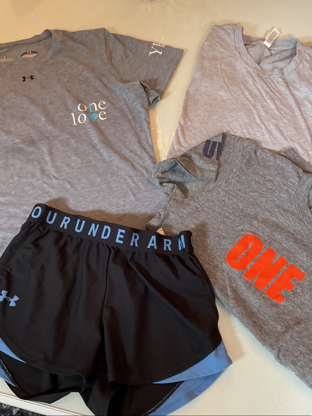 Bundle of one under armour shorts and 3 short sleeve tshirts